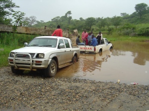 Pulling out our teammate, on our way to church. Stuck in the river--even with a 4x4.