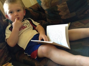 Okay, he's just pretending to read. :)